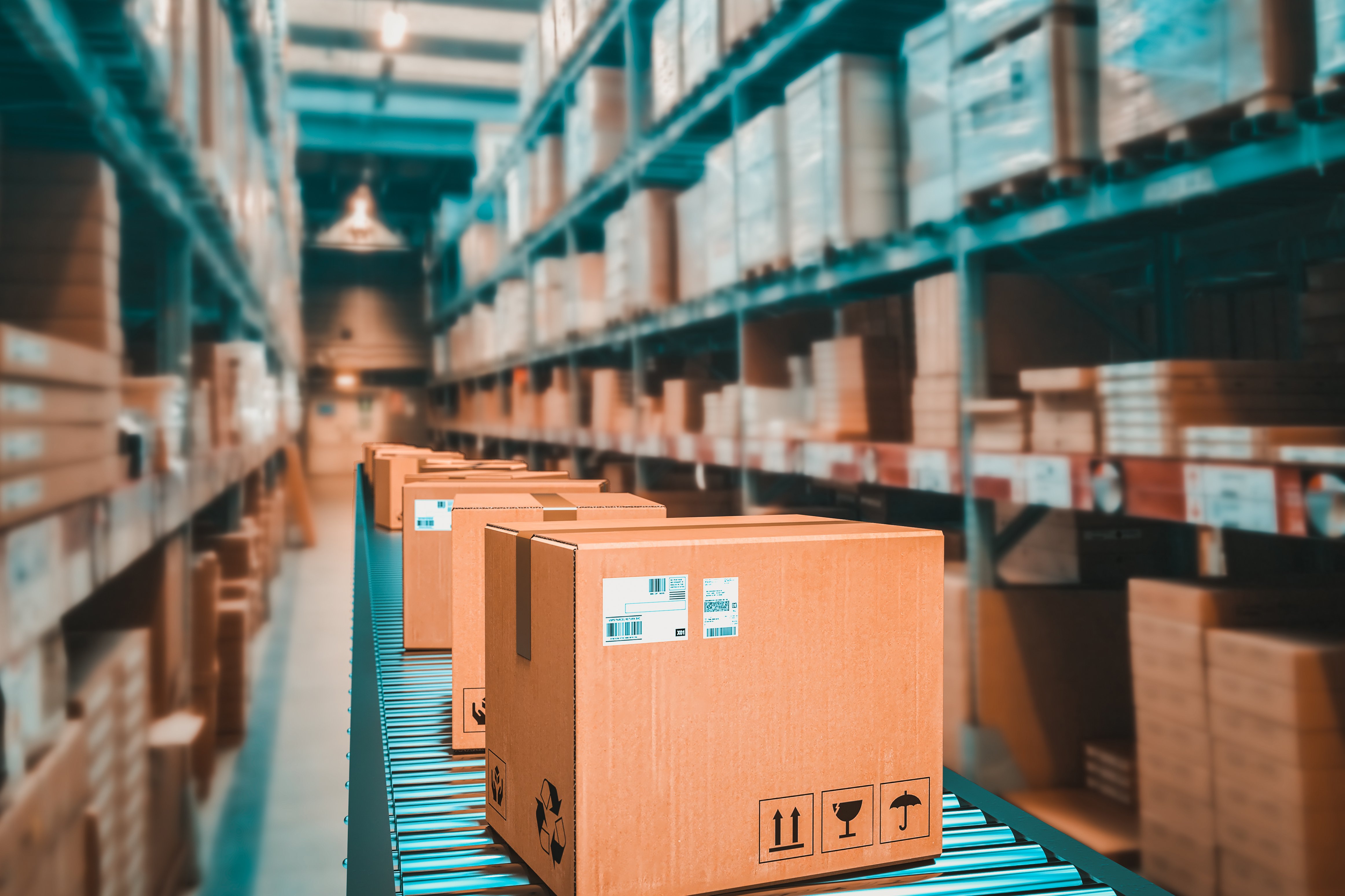 Warehouse environment displaying closed, sealed boxes in motion