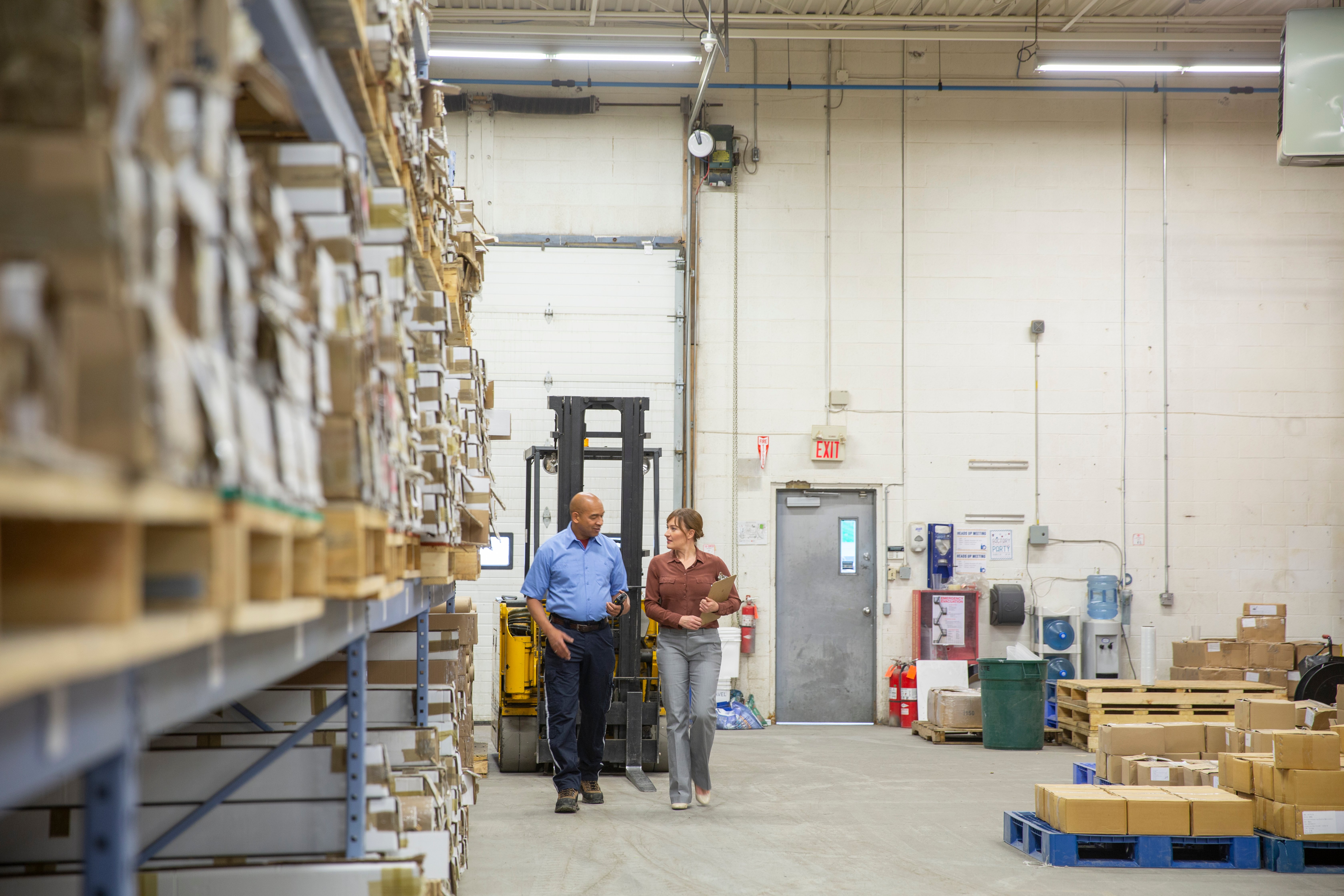 Warehouse team members discussing incentives for the warehouse staff