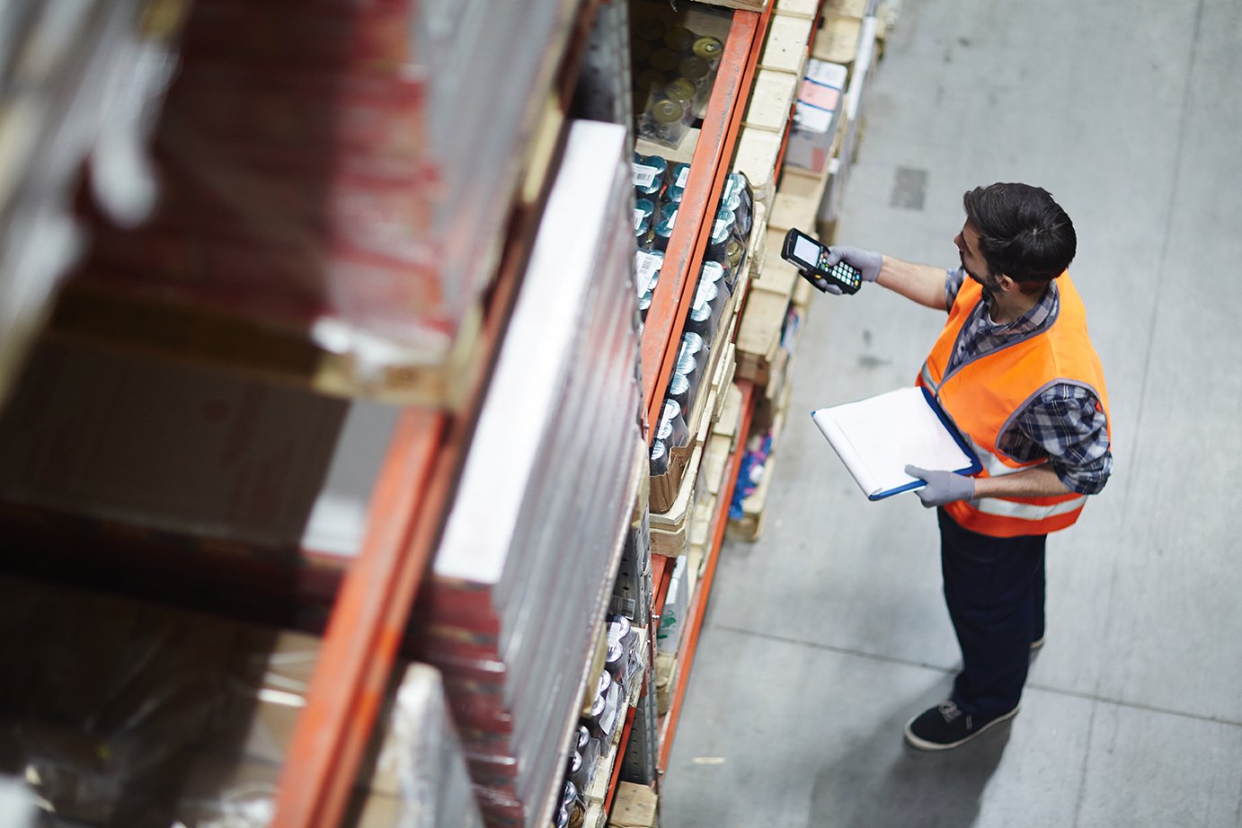 Warehouse worker conducting an inventory audit ahead of contract negotiations